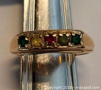 Front view showing gemstone row and gold band