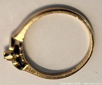 Full ring side view showing engraving and band condition