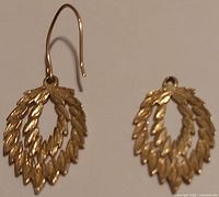 Front view of both earrings showing design details and missing hook