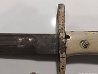 Ricasso showing stamped Solingen marking, painted grip and guard