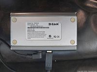 Bottom of D-Link DUB-H4 hub showing model label and wear