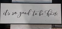 Front view of sign showing text and frame