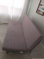 Sofa in angled view showing seat and back fabric