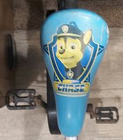 Close-up of blue saddle with Chase graphic