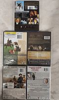 Back covers of five discs displaying format and region info