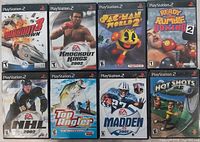 Front view of all eight PS2 game cases arranged in grid