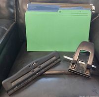 Folders, Swingline 3-hole punch, 2-hole punch displayed together