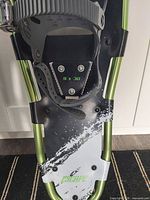 Top view of binding and size marking 9 x 30 on one snowshoe