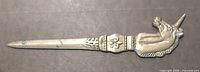 Full view of letter opener front showing unicorn head, decorative band, blade length