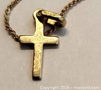 close-up of cross pendant and bail detail