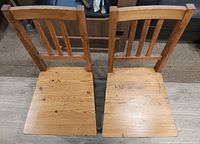 Top view of both chairs showing seat surfaces and slat backs