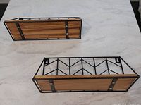 Pair of shelves showing wood fronts and metal frames