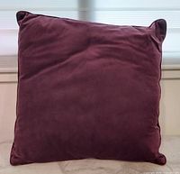 Front of cushion showing plain velvet surface