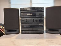 Front view of Venturer CD27B-41D main unit flanked by two speakers