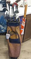 Bag with clubs and umbrella
