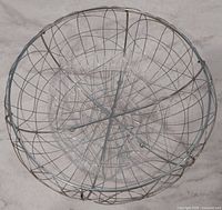 Top view of chrome wire bowl showing geometric pattern and diameter