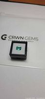 Emerald in display box on CRWN GEMS card