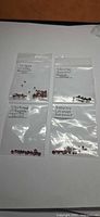 Four labelled plastic bags containing loose garnet stones