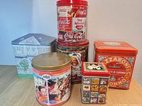 Group shot of all six tins to show variety and overall condition