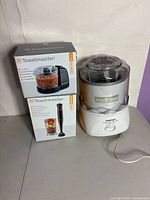 Group shot of all three appliances: Cuisinart ice cream maker and two boxed Toastmaster units