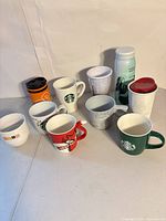 Group of 10 drinkware items arranged on tabletop