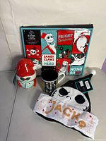 Overview of all four items: sock box, Sally luminary, mug, Jack hat