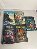 All five Hardy Boys books laid out