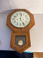 Full view of the oak regulator wall clock