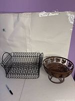 Rectangular wire basket and pedestal fruit bowl side-by-side