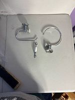 All three chrome and ceramic bathroom hardware pieces displayed