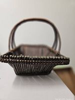 Front view showing tapered rectangular shape and weaving