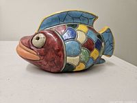 Left side view of multicolor ceramic fish figurine