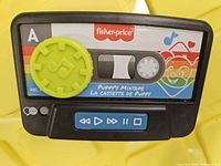 Front view showing cassette graphic, dial and buttons