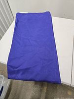 Royal blue fabric panel folded on table