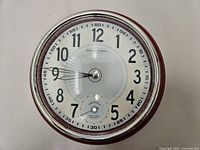 Front view of Sterling & Noble wall clock showing entire face and bezel