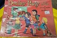 Front cover of Donkey Party game showing title, illustration, and price sticker noting incomplete