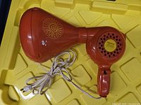 Mahdeen Curl-N-Lite orange hair dryer, side profile with cord