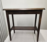 Side view of console table showing top and shelf