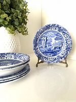 Stacked bowls and one dessert plate showing Blue Italian pattern