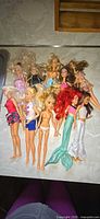 All ten dolls laid out on countertop