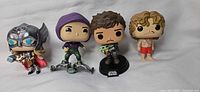 Group shot of all four Funko Pop figures
