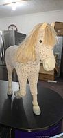 Full left-front view of American Girl Picasso horse showing mane, spots, legs