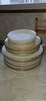 Stack showing all plate sizes in lot