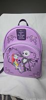Front view of purple Nightmare Before Christmas Loungefly backpack