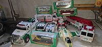 Group shot of boxed and loose Hess vehicles