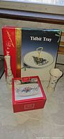 Front view showing boxed Tidbit Tray, boxed Lenox bowl, two Lenox bud vases