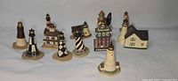 Group view of ten Lenox miniature lighthouses