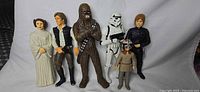 All six Star Wars figures standing in a row