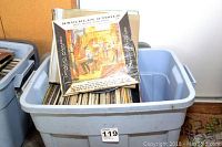 Plastic bin filled with vintage vinyl record albums including Knuckles O'Toole album on top.