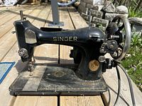 Left side view of Singer black cast-iron sewing machine